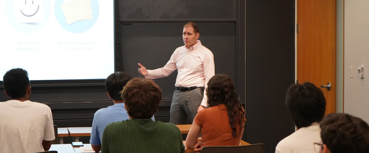 A man presenting to a group of people